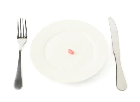 Single candy in a plate isolated Stock Photos