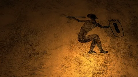 A single Cave Painting of  Warrior with dancing fire illumination on cavern wall Stock Footage 100946798