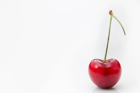 Single cherry on a white background. Stock Photos