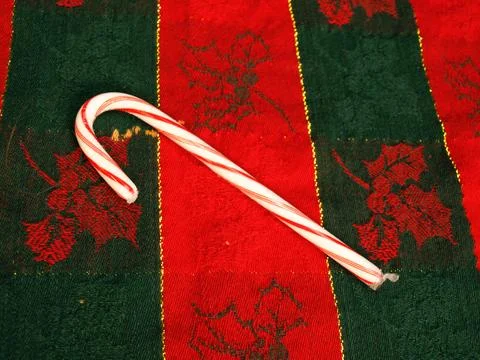 Single christmas peppermint candy cane for holiday sweets Stock Photos