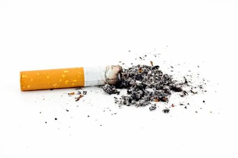 Single cigarette butt with ash isolated on white background Stock Photos