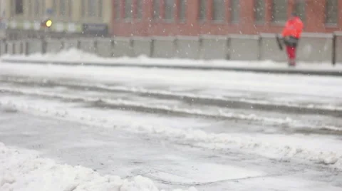 Single city worker shoveling sidewalk of station Stock Footage 59652140