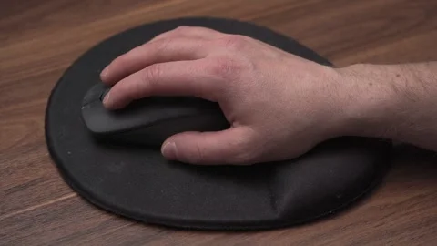 Single clicking mouse on ergonomic mousepad, close up view Stock Footage 335484066