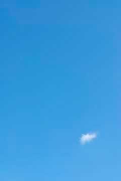 Single Cloud Against Blue Sky Stock Photos