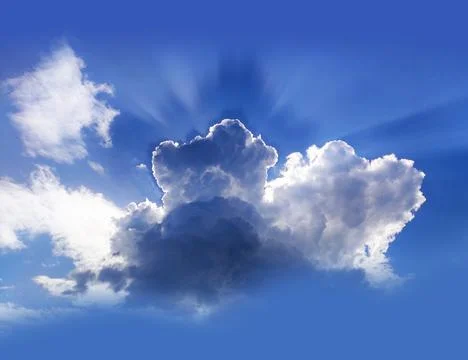 Single cloud in the blue sky with sun rays Stock Photos