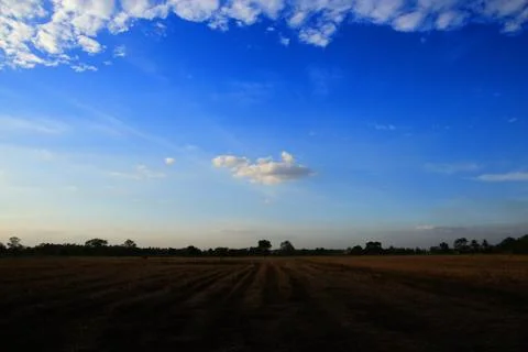 A single cloud in a clear sky scene surrounded by glove of clouds. low hangin Stock Photos