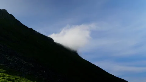 Single Cloud Sliding Over Dark Nordic Ridge in Lofoten Stock Footage 340139910