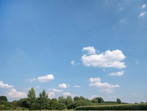 Single clouds in rural landscape over a lonely field Fotos Stock