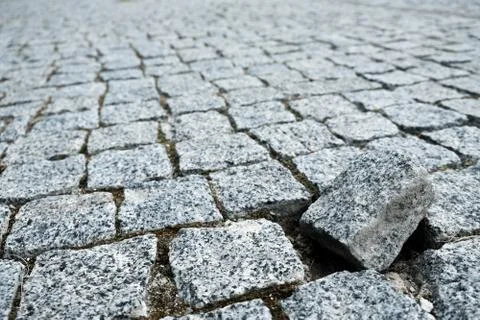 Single cobble out of the structure on a cobblestone street in an old medieval Stock Photos