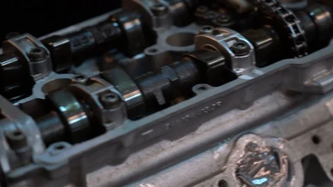 Single compound shot overviewing racing engine with open cylinder head. Stock Footage 99337584