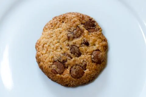 A single cookie on a plate Stock Photos