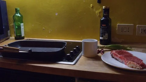 Single cooking a steak at home Stock Footage 77479586