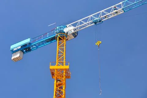 Single crane in construction-area with blue-sky. Stock Photos