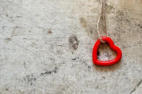 Single cute heart hanging on the string Single cute red heart hanging on t... Stock Photos