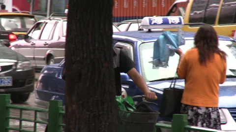 Single cyclist rides throughout shot with cars behind Stock Footage 38172871