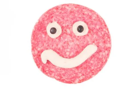 A single danish salami slice with a cheese smile Stock Photos