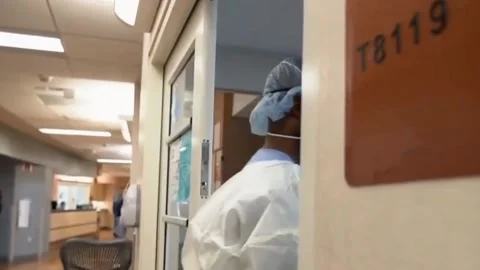 Single-day COVID-19 death record as hospital staff soldier on (1) Stock Footage 145873945