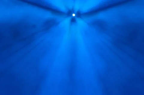 Single distant spotlight in foggy blue air Stock Illustration