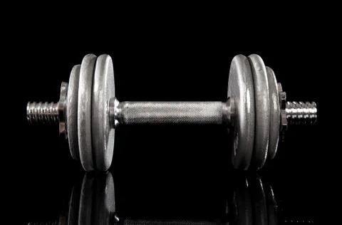Single dumbbell on black Stock Photos