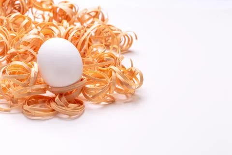 A single Easter egg in sawdust Stock Photos
