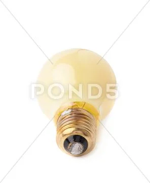 Single electric bulb lying on its side, isolated over the white background Stock Photos