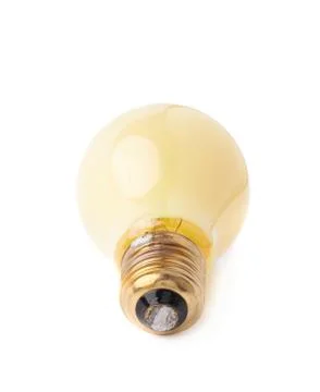 Single electric bulb lying on its side, isolated over the white background Stock Photos