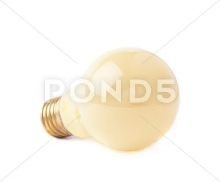 Single electric bulb lying on its side, isolated over the white background Stock Photos