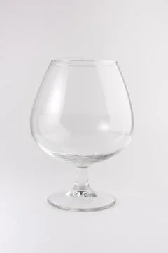 Single empty brandy glass Stock Photos