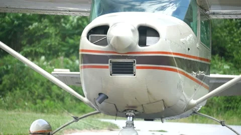 Single Engine Airplane Idling Closeup With Door Opening Stock Footage 154436395