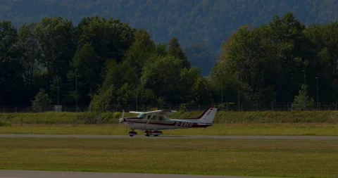 Single-engine, high wing aircraft Cessna 172N Skyhawk II vacating the runway Stock Footage 221274508