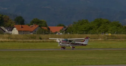 Single-engine, high wing aircraft Cessna 172N Skyhawk II landing Stock Footage 221274649