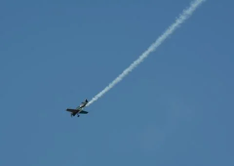 Single-engine monoplane doing stunts Stock Photos
