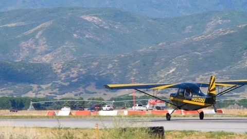Single engine monoplane is running for full stop Stock Footage 116736651