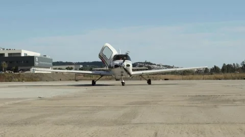 Single Engine Piston Airplane at Airport - Cirrus SR22 Stock Footage 141773391