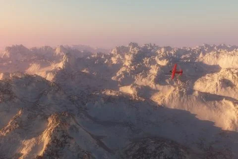 Single engine plane over snow mountains in morning mist Stock Photos