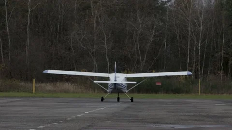 A single-engine private jet is moving to the runway. Stock-Footage 146828058