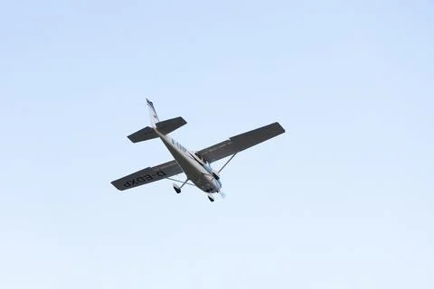 Single engine ultralight aircraft flying in the sky. empty space for insertion. Stock Photos