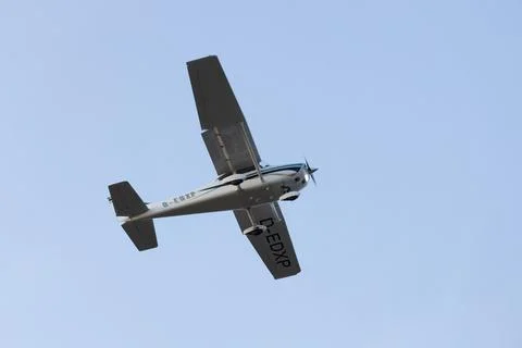 Single engine ultralight aircraft flying in the sky. empty space for insertion. Stock Photos