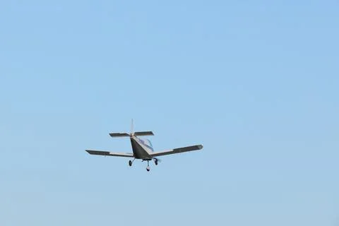Single engine ultralight aircraft flying in the sky. empty space for insertion. Stock Photos