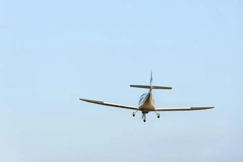 Single engine ultralight aircraft flying in the sky. empty space for insertion. Stock Photos