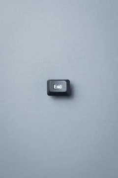 Single Escape Key On Gray Background With Minimal Copy Space Stock Photos