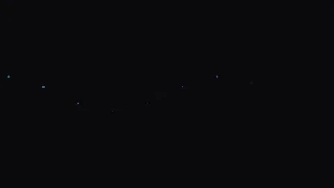 A single faint glowing light point captured against a deep black background Stock Footage 339614856