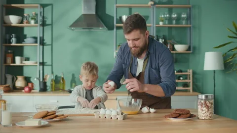 Single Father With Son Cooking Together. Cute Child Helping His Father. Stock Footage 194611204