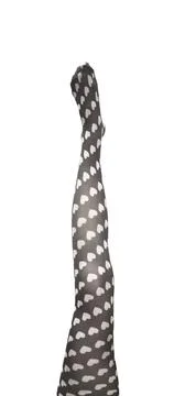 Single female leg in patterned tights raised upward against white background. Stock Photos