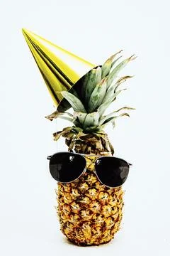 Single festive pineapple with sunglasses Stock Photos