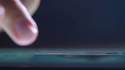 Single finger taps gadget screen close up Stock Footage 71749125