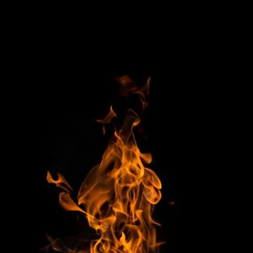 Single fire flame on black background in high resolution. Foto stock
