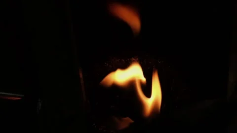A single fire flame burns in slow-motion Stock Footage 208837619