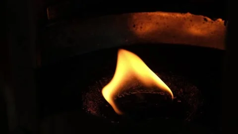 A single fire flame burns in slow-motion Stock Footage 208837645