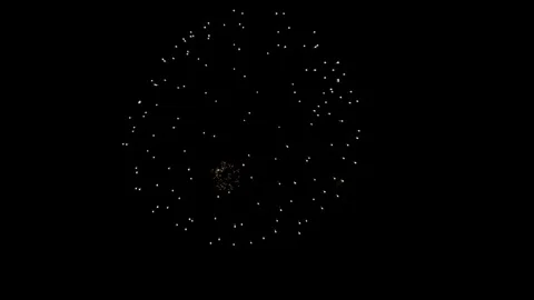 Single firework burst glowing against black night sky background Stock Footage 329674144